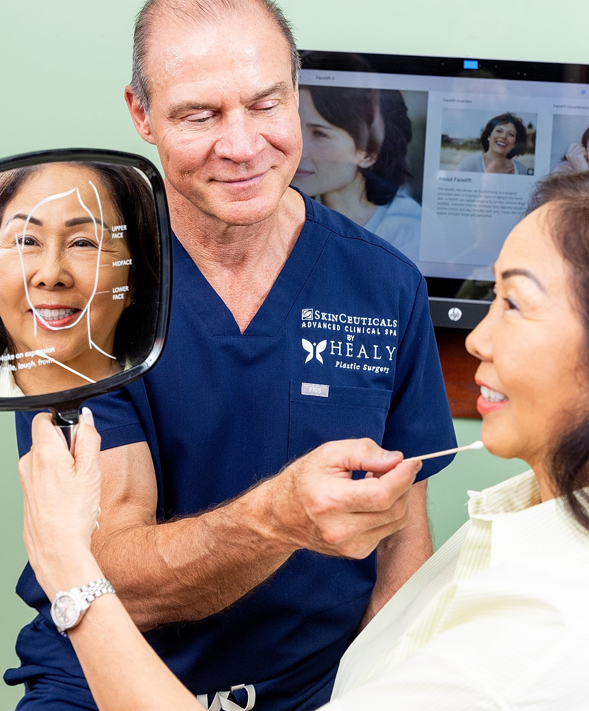 Smiling woman in white dress by a pool.