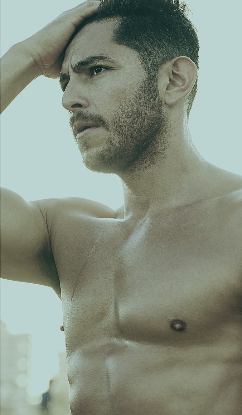 Man with a thoughtful expression and muscular build.