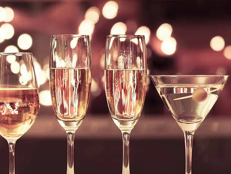Glasses of champagne and cocktail at celebration.