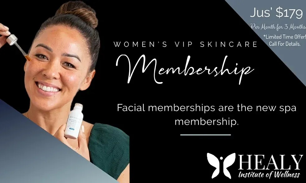 Smiling woman in white dress by a pool.