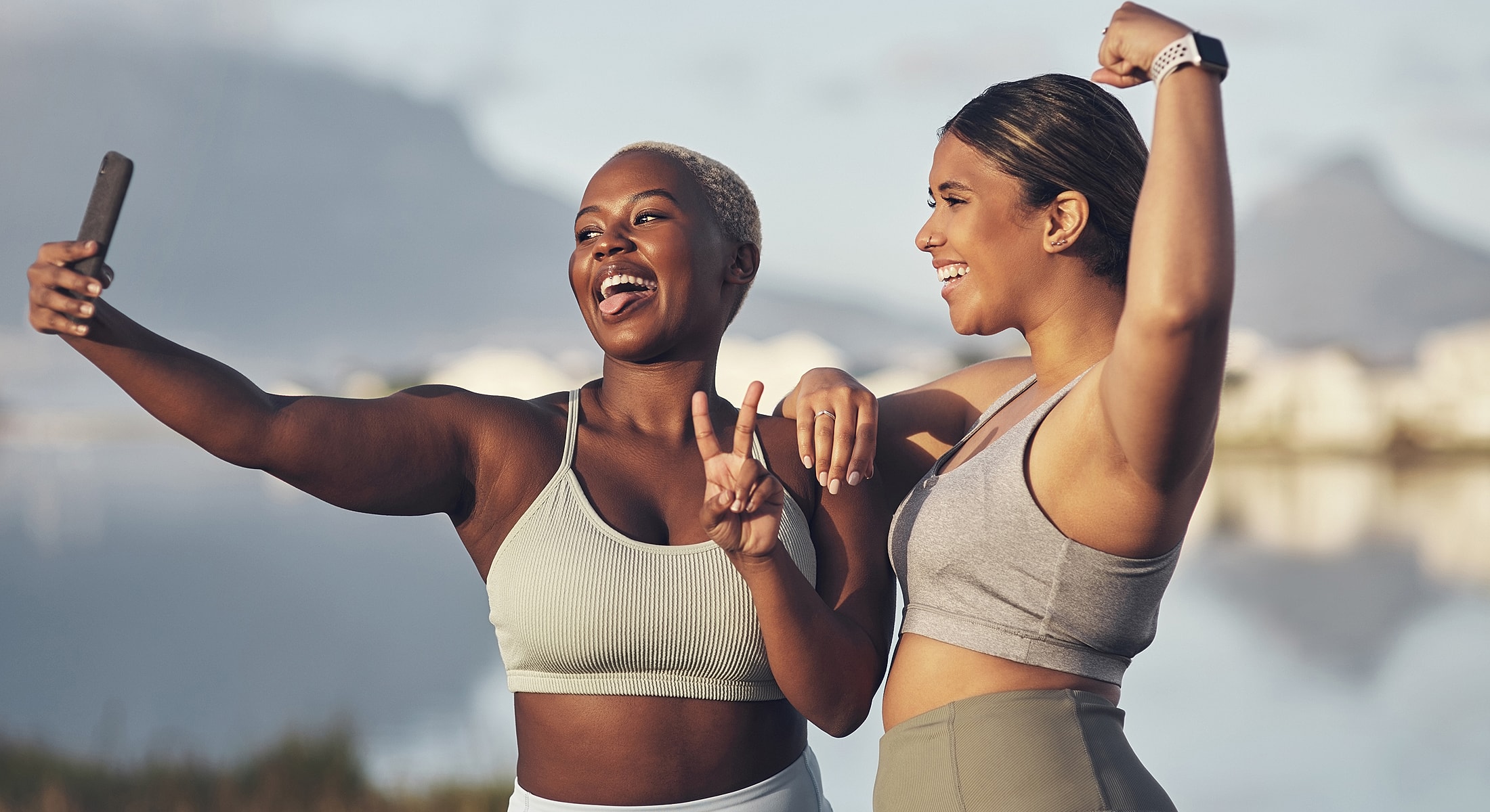 Friends taking a fun selfie outdoors together.